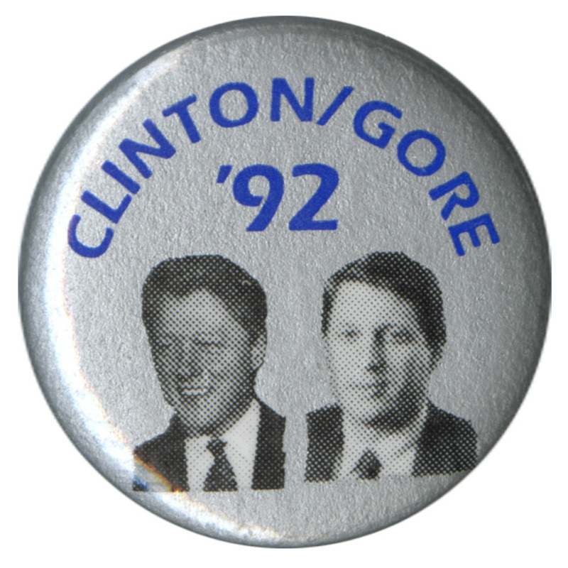 Round, silver button with black and white photographs of Bill Clinton and Al Gore. Blue text reads "CLINTON/GORE '92"
