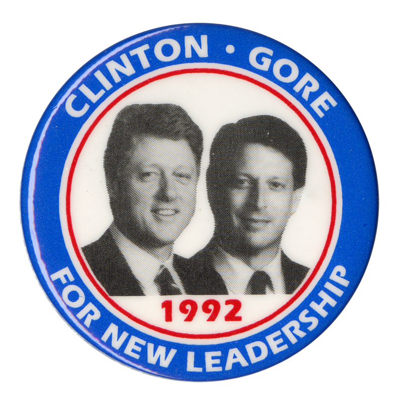 Round button with a blue and red border and black and white photographs of Bill Clinton and Al Gore. White and red text reads "CLINTON GORE 1992 FOR NEW LEADERSHIP"