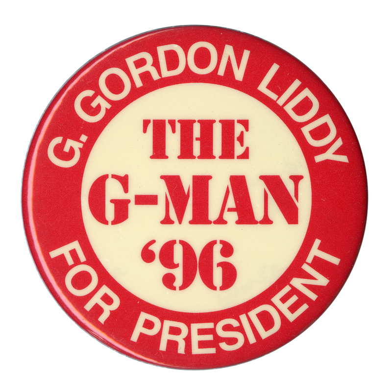 Round, red and white button with contrasting white and red text reading "G. GORDON LIDDY FOR PRESIDENT THE G-MAN '96"