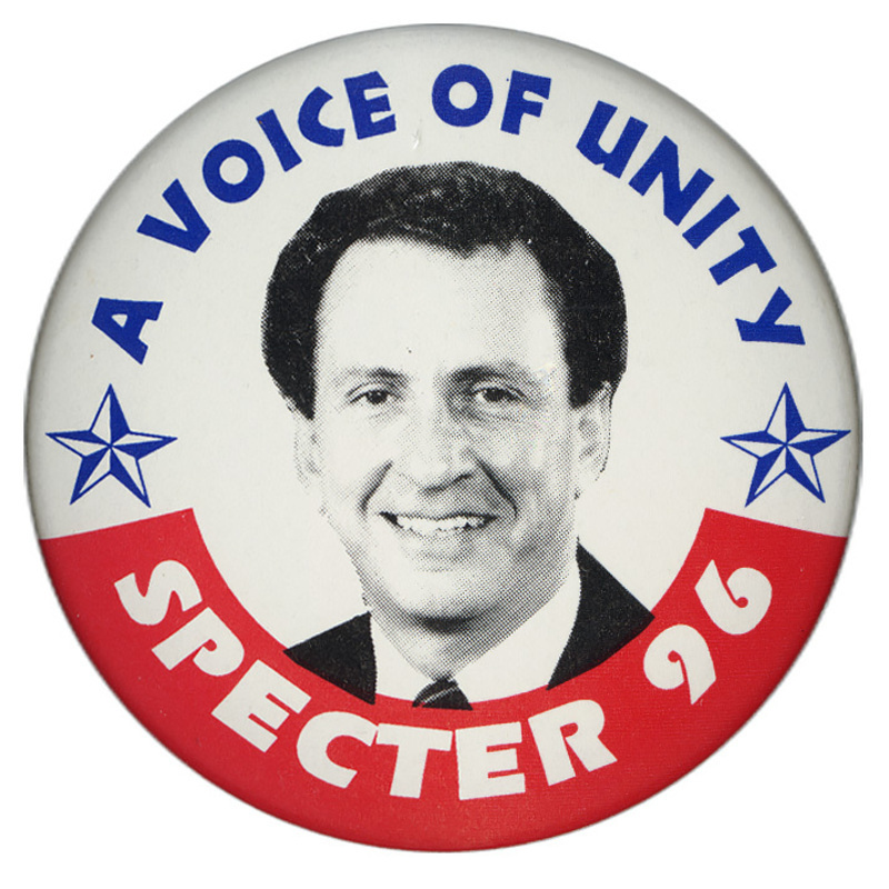 Round, white button with a red band along the bottom and a black and white photograph of ARLEN SPECTER. Blue and white text reads "A VOICE OF UNITY SPECTER 96"