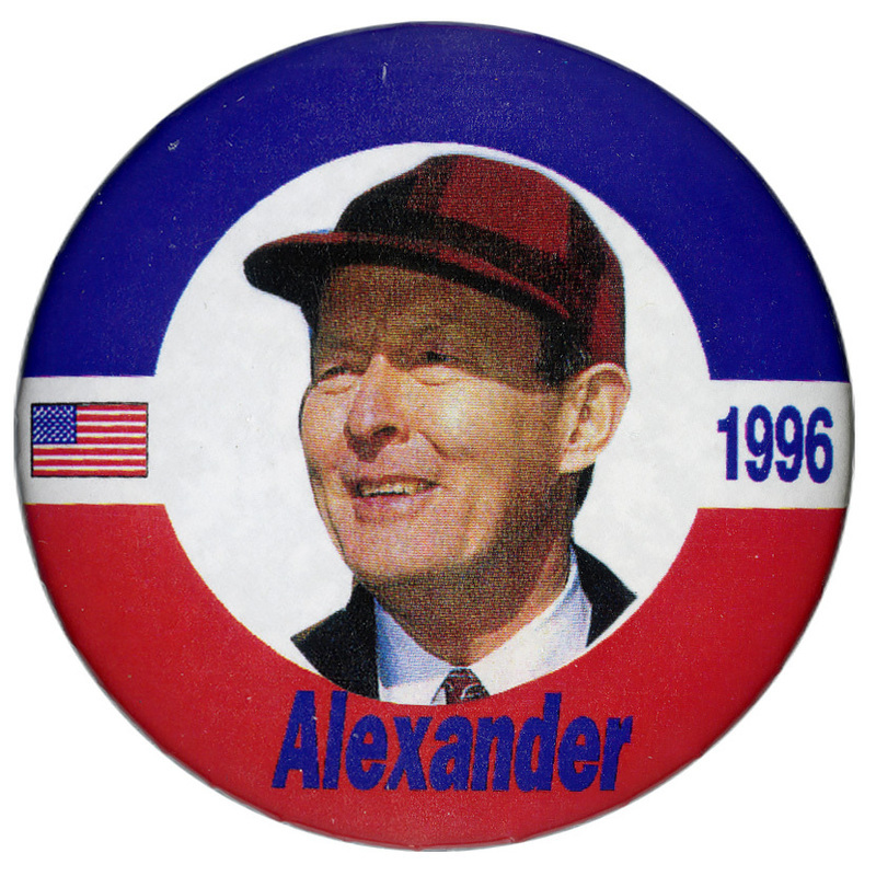 Round button with a blue and red border. In the center is a color photograph of Lamar Alexander. Blue text reads "1996 Alexander"