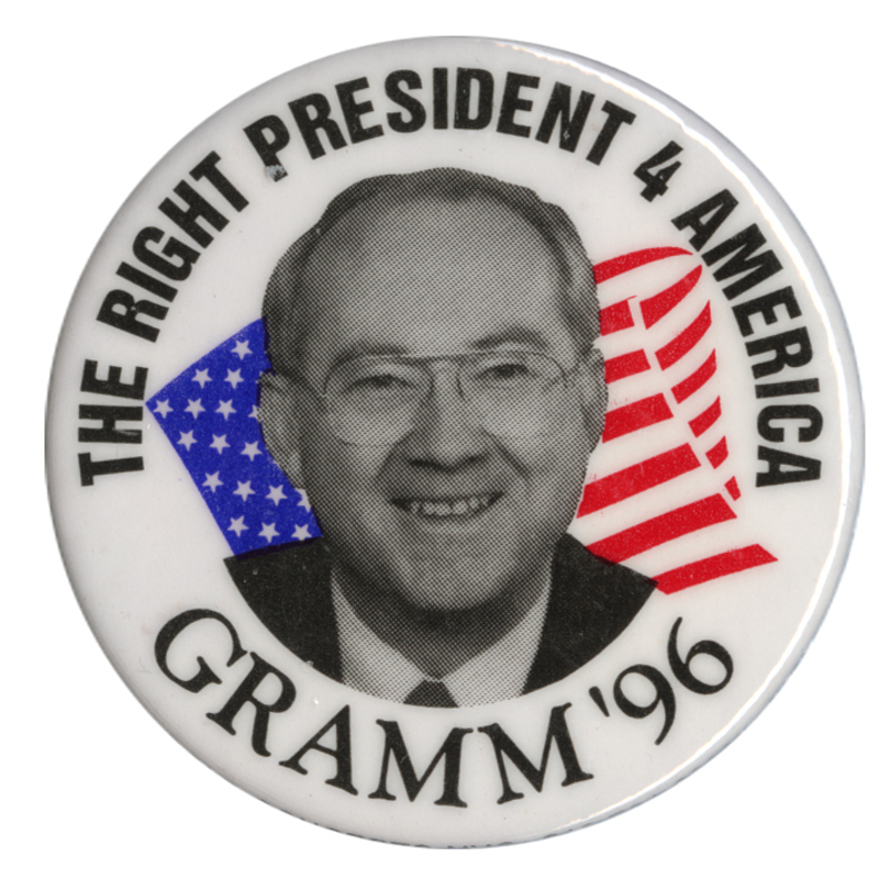 Round, white button with a black and white photograph of Phil Gramm against a red, white, and blue US flag. Black text reads "THE RIGHT PRESIDENT 4 AMERICA GRAMM '96"