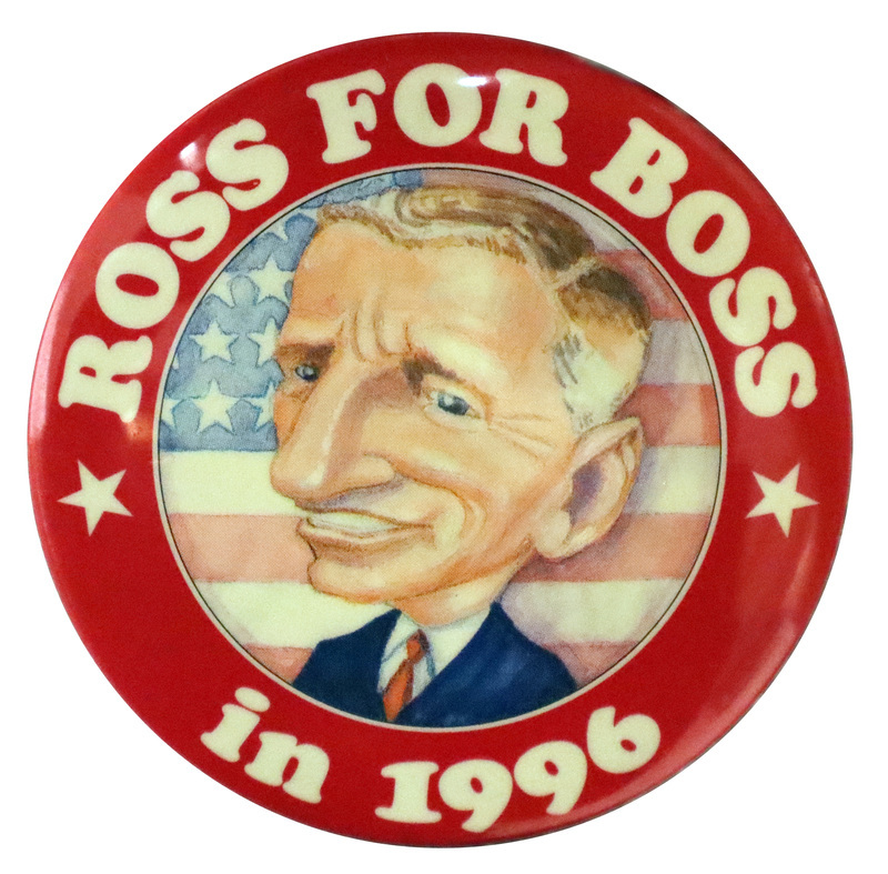 Round button with a red border. In the center is a color caricature painting of Ross Perot against a US flag. White text around the edge of the button reads "ROSS FOR BOSS in 1996"