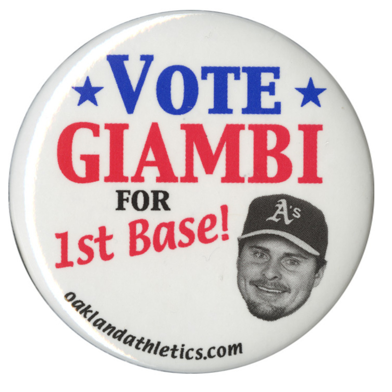 Round, white button with a black and white photograph of Jason Giambi. Red, blue, and black text reads "VOTE GIAMBI FOR 1st Base! oaklandathletics.com"
