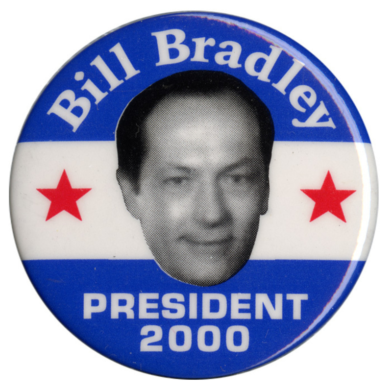 Round, blue and white button with a black and white photograph of Bill Bradley between two red stars. White text reads "Bill Bradley PRESIDENT 2000"