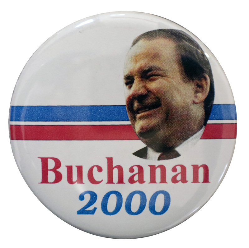 Round, white button with red and blue horizontal stripes and a color photograph of Pat Buchanan. Red and blue text reads "Buchanan 2000"