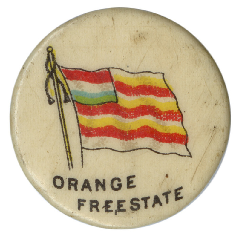 Round, white button with a color illustration of the flag of the Orange Free State, white and orange horizontal stripes with a red, white, and blue design in the upper left corner. Black text reads "ORANGE FREE STATE."