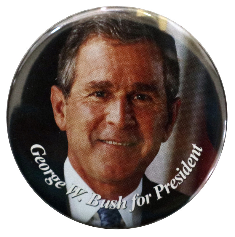 Round, color photograph of George W. Bush. White text reads "George W. Bush for President"