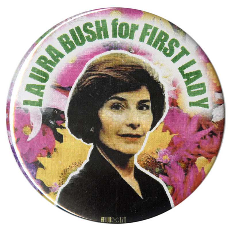 Round button with a color photograph of Laura Bush against a color photograph of flowers. Green text reads "LAURA BUSH for FIRST LADY"