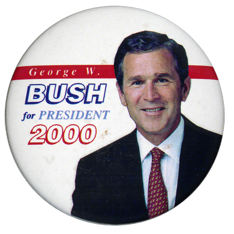 Round, white button with a color photograph of George W. Bush. White, red, and blue text reads "George W. BUSH for PRESIDENT 2000"