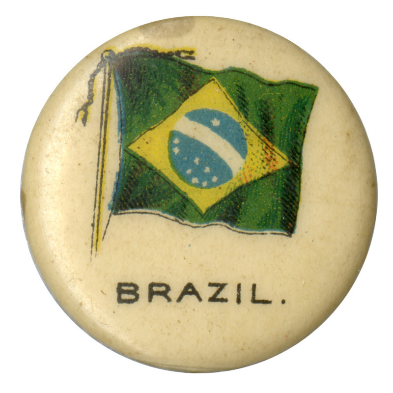 Round, white button with a color illustration of the flag of Brazil, a yellow diamond containing a blue and white central decoration, on a green field. Black text reads "BRAZIL"