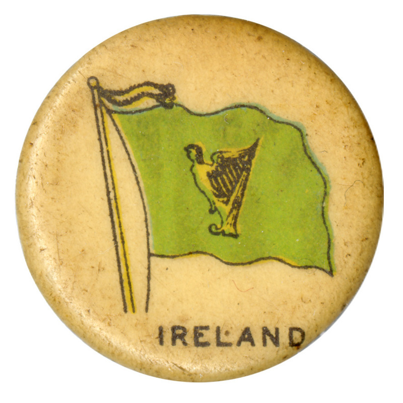 Round, white button with a color illustration of the green harp flag of Ireland, a gold harp decorated with the image of a woman on a green field. Black text at the bottom reads "IRELAND."