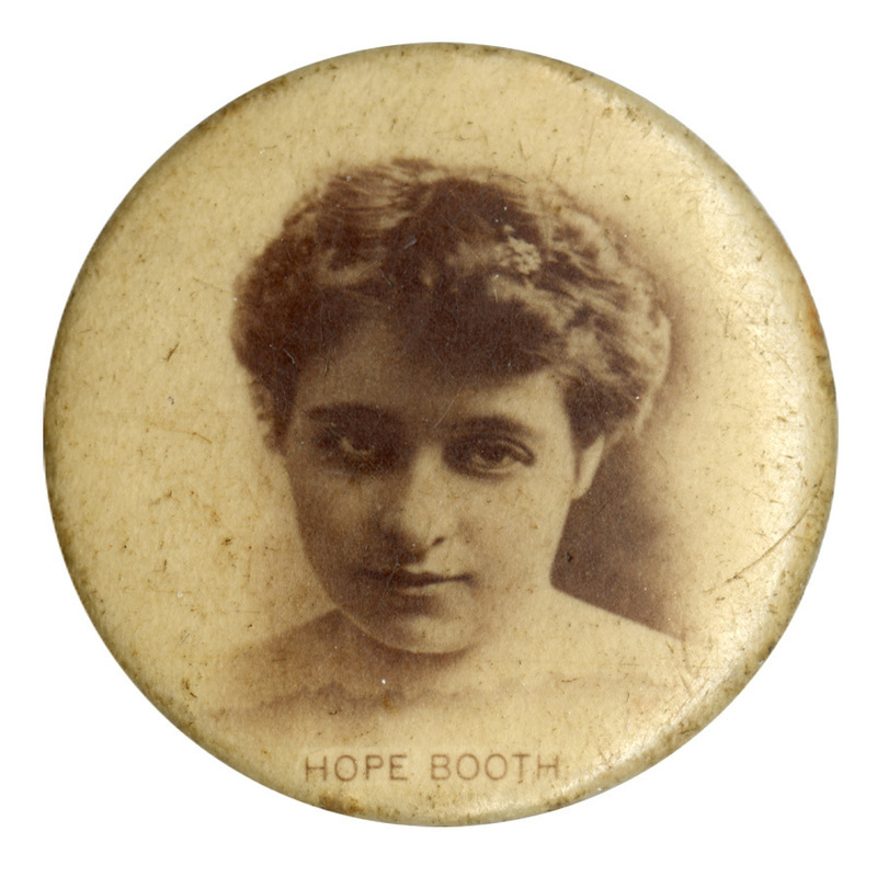 Round, white button with a black and white photograph of Hope Booth. Black text at the bottom reads "HOPE BOOTH"