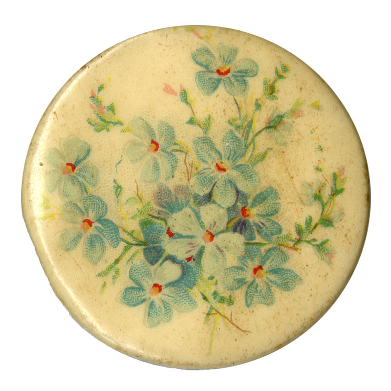 Round, white button with a color illustration of blue flowers