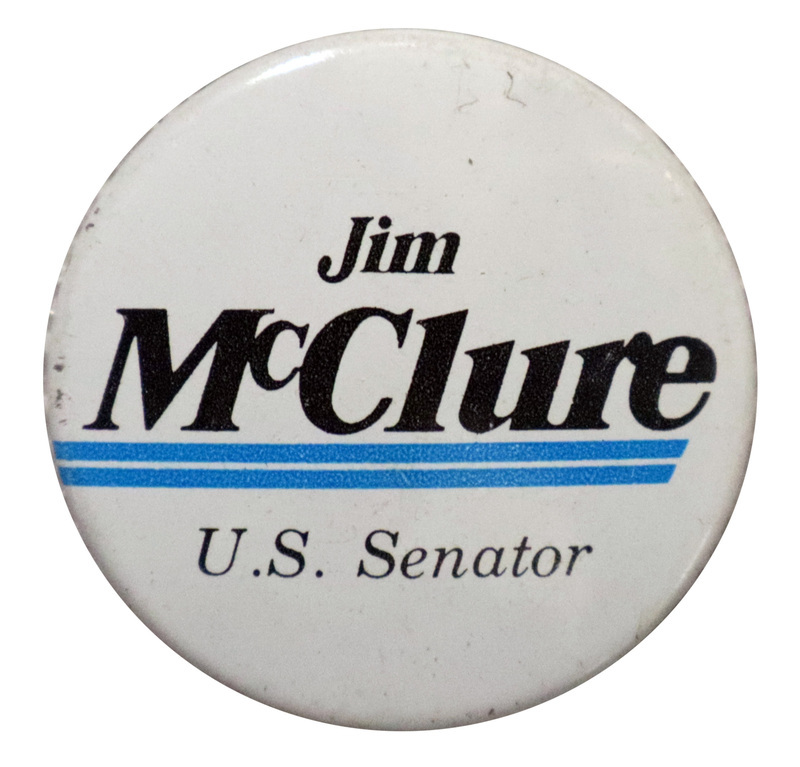 Round, white button with horizontal blue stripes and black text that reads "Jim McClure U.S. Senator"