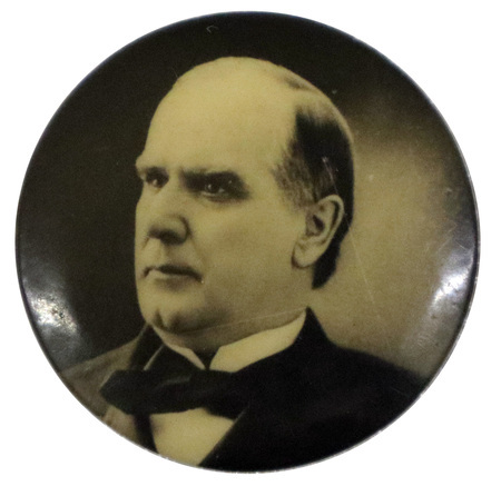 Round button with a black and white portrait of William McKinley.