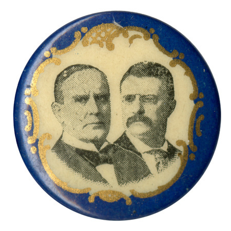Round, white button with a blue border and portraits of William McKinley on the left and Theodore Roosevelt on the right.