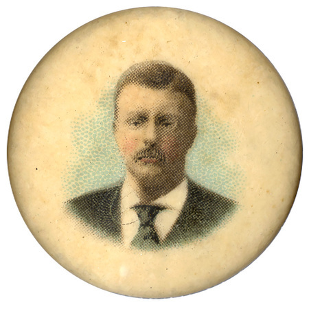 Round, white button with a faded color portrait of Theodore Roosevelt.