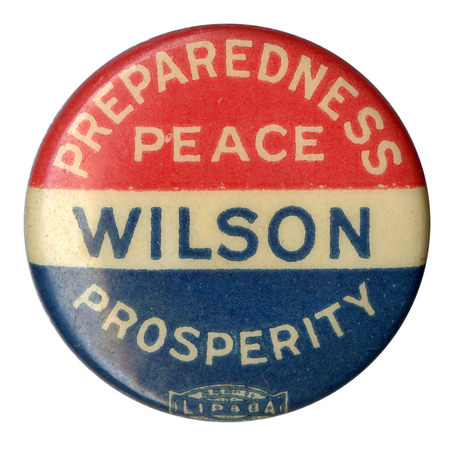 Round button with text reading "Preparedness Peace Prosperity" in bold white letters across a red, white, and blue striped background. Bold blue text reading "Wilson" across the center. 