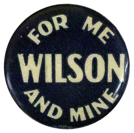 Round, blue button with bold white text reading "For me and mine Wilson".