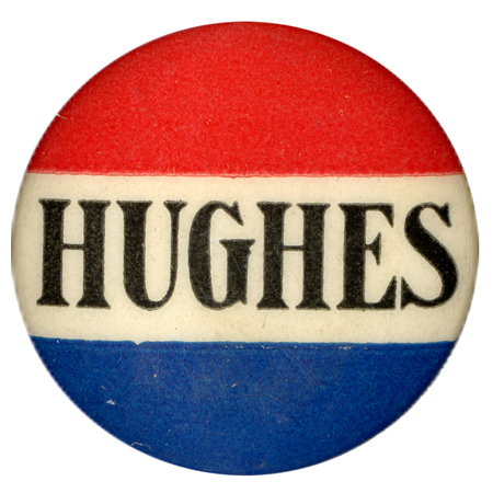 Round button with three red, white, and blue horizontal stripes, and black, bolded font reading "Hughes" along the white stripe. 
