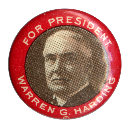 Round button with a red border, and black and white portrait of Warren G. Harding. White text reads "For President Warren G. Harding."