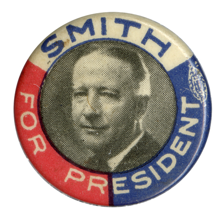 Round button with red, white, and blue trisected border, and black and white portrait of Alfred E. Smith. White and blue text surround the portrait, along the border and reads: "Smith for President". 