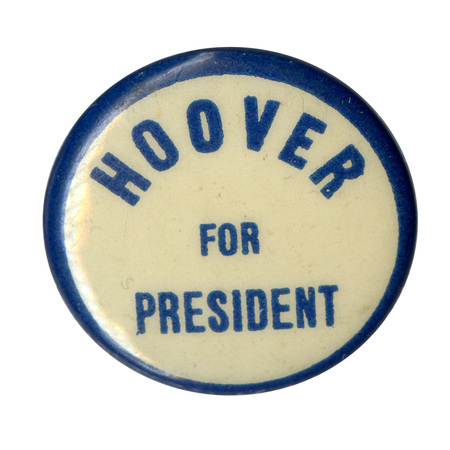 Round, white button with a blue border, and blue text reading "Hoover for President". 