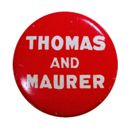 Round, red button with bolded, white font reading "Thomas and Maurer". 