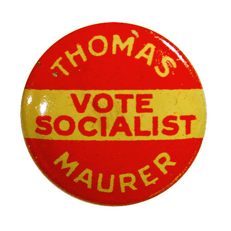 Round, red button with white and red font "Thomas Maurer Vote Socialist".