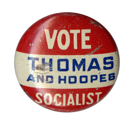Round, red button with a horizontal strip across the center. White and blue text reads "Vote Socialist, Thomas and Hoopes." 