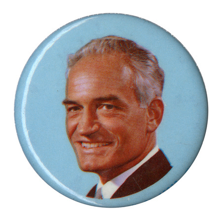 Round, pale blue button with a color photograph of Barry Goldwater.