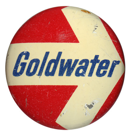 Round, red button with a large white arrow pointing to the right and blue text reading "Goldwater."