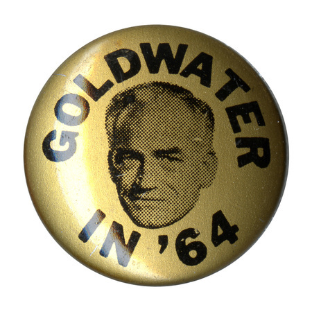 Round, gold button with a portrait of Barry Goldwater and the text "Goldwater in '64"