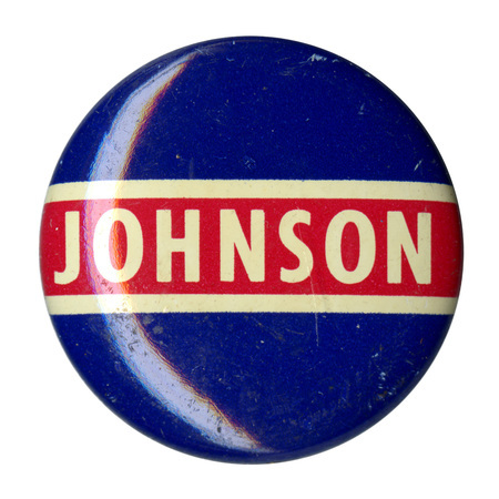 Round, blue button with red and white bands and text reading "Johnson."