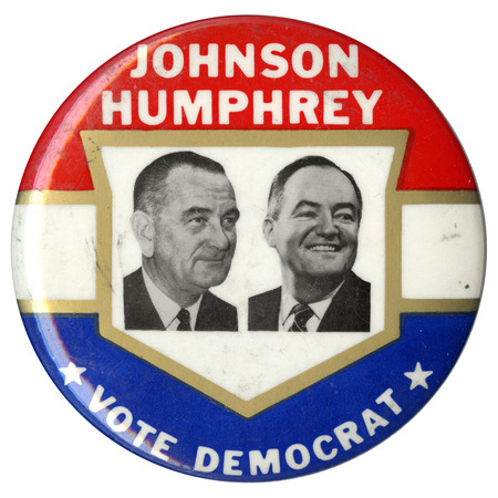 Round, red, white, and blue button with gold striping. Black and white portraits of Lyndon B, Johnson and Hubert Humphrey are framed with the text "Johnson Humphrey Vote Democrat."