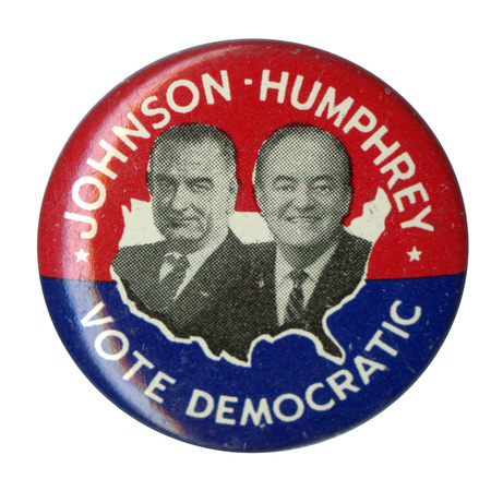 Round, red and blue button with portraits of Lyndon B. Johnson and Hubert Humphrey against an outline of the United States. White text reads "Johnson-Humphrey Vote Democratic"