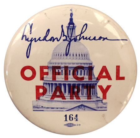 Round, white button with an image of the United States Capitol building and Lyndon B. Johnson's signature in blue. Red text reads "OFFICIAL PARTY."