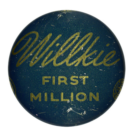 Round, dark blue button with gold font reading "Willkie First Million". 