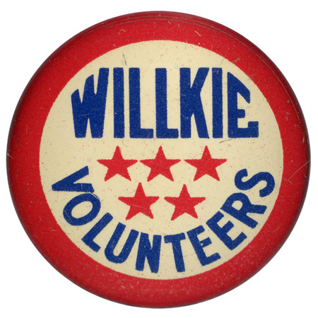 Round, white button with a red border. Blue text reads "Willkie Volunteers", with five red stars at the center. 