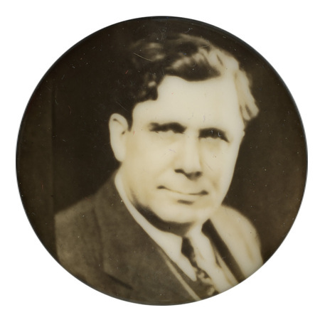 Round button with a black and white portrait of Wendell Willkie.