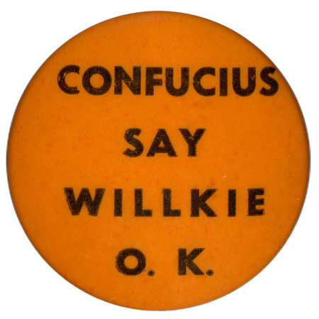 Round, orange button with black text reading "Confucius say Willkie O.K.".