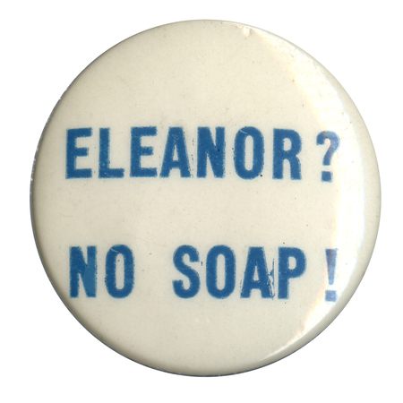 Round, white button with light blue text reading "Eleanor? No soap!". 