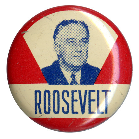 Round, red button with a portrait of Franklin Roosevelt. A white, horizontal stripe sits below the portrait and contains blue text reading "Roosevelt". 