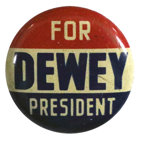 Round button with three horizontal stripes of red, white, and blue. White and blue text reads "Dewey for President". 