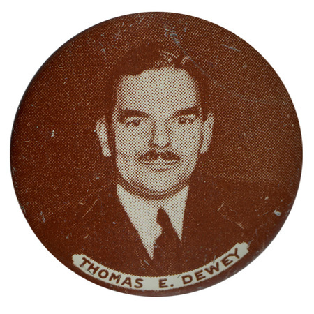 Round, grayscale button with a portrait of Thomas E. Dewey. Text within a banner reading "Thomas E. Dewey" sits below the portrait. 