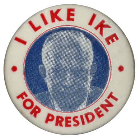 Round, white button with a grayscale portrait of Dwight D. Eisenhower. Red text encircles the portrait and reads "I like Ike for President". 
