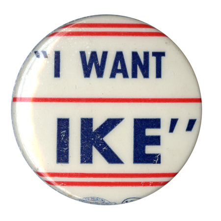Round, white button with narrow, red, horizontal stripes. Blue text reads ""I want Ike"". 