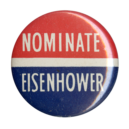 Round button with two horizontal stripes of red and blue, with a narrower stripe between the two. White text reads "Nominate Eisenhower". 