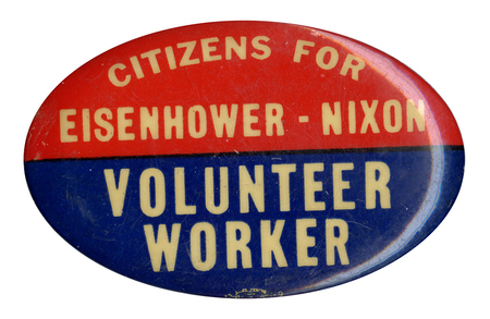 Oval, red and blue button with white text reading "Citizens for Eisenhower-Nixon Volunteer Worker". 